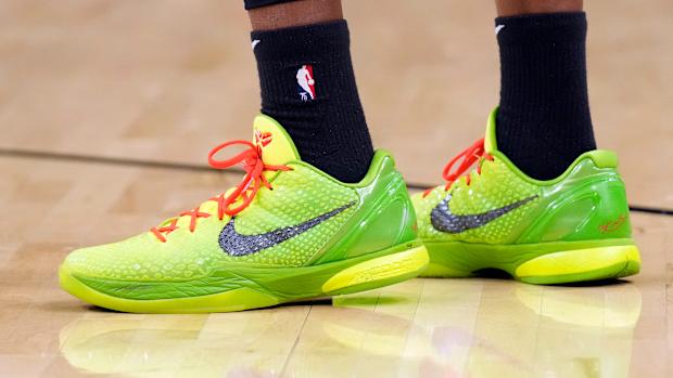 View of green Nike Kobe shoes.